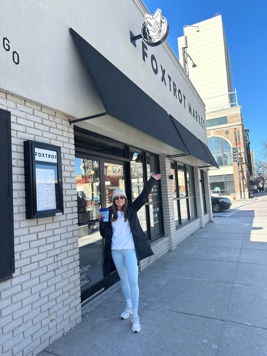 Minky Muffins' Founder standing in front of a Foxtrot store in Chicago