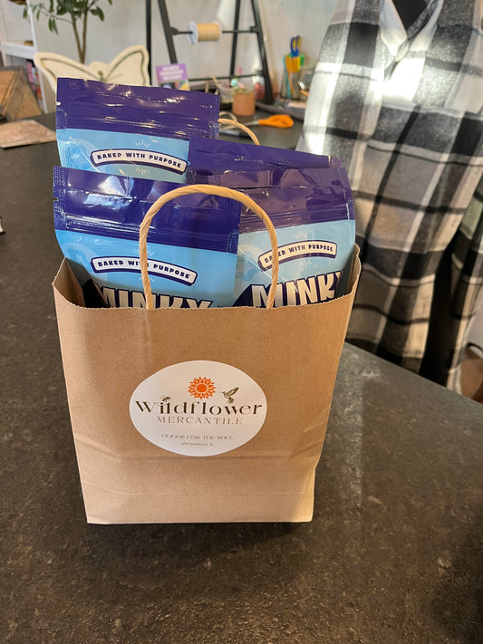checkout bag from Wildflower Mercantile filled with 4 bags of Minky Muffins