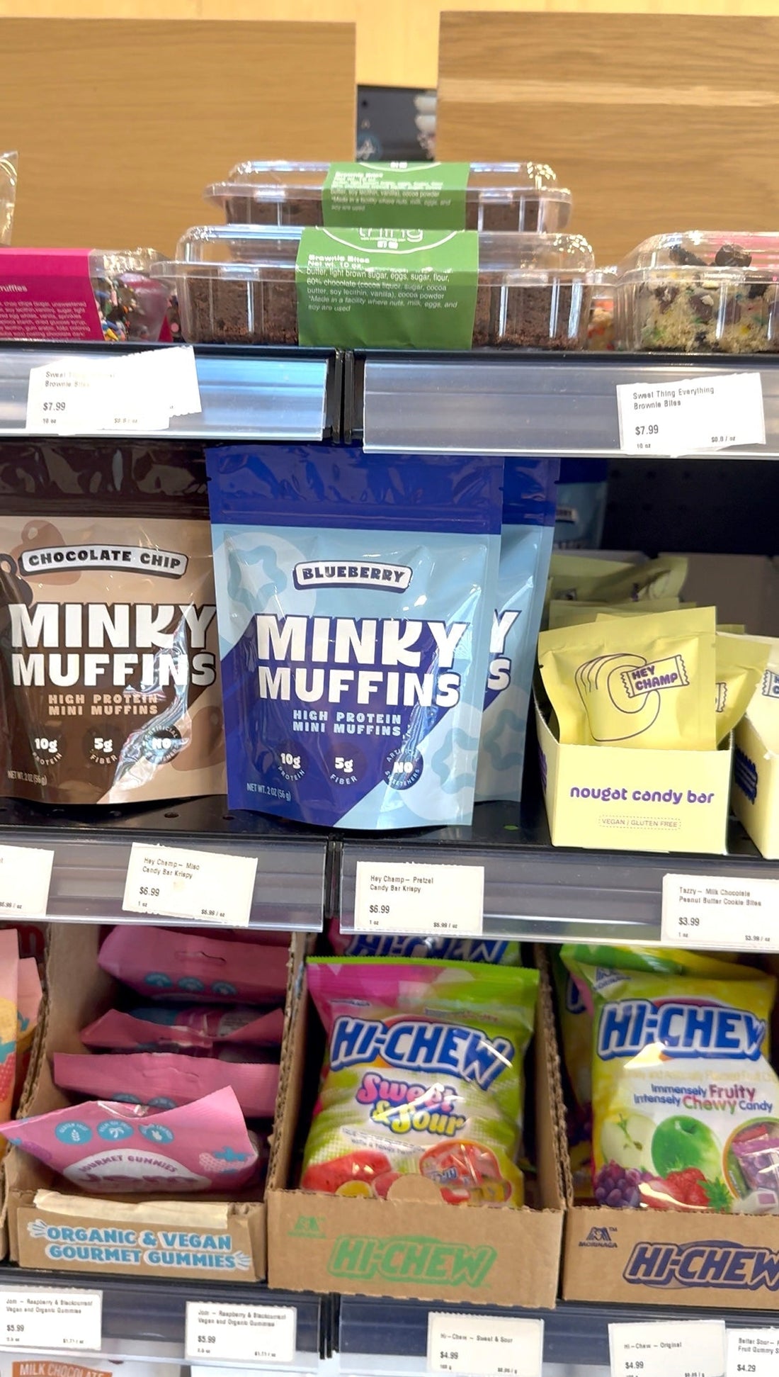 Minky Muffins on shelf at a store next to other food products sold on a shelf. 