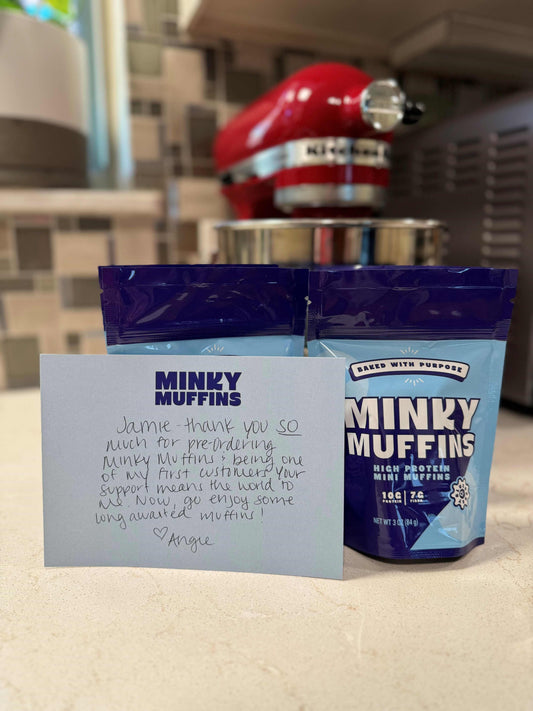 Two bags of Minky Muffins with a hand-written thank you note for the order