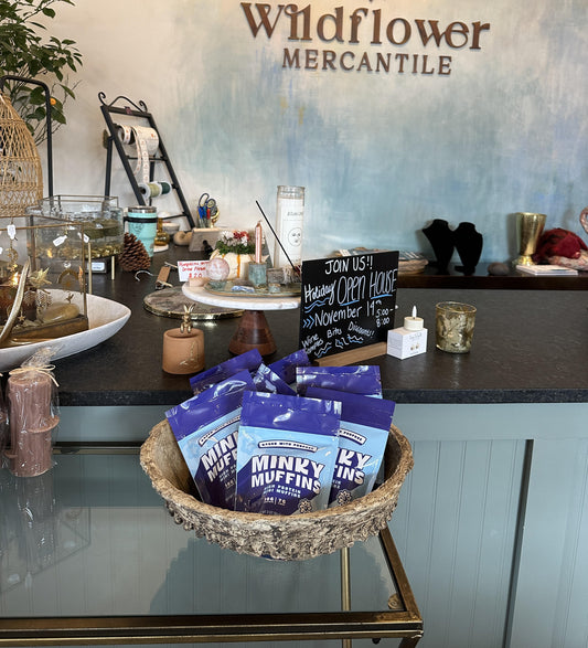 A basket full of Minky Muffins at the checkout counter of a store